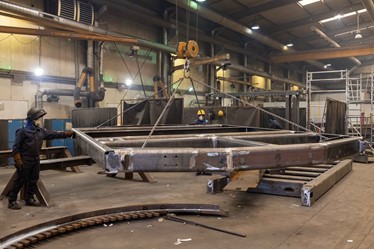 The steel structure is hoisted into place