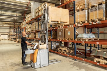 Pallets are lifted down in the logistics center in Hammelev